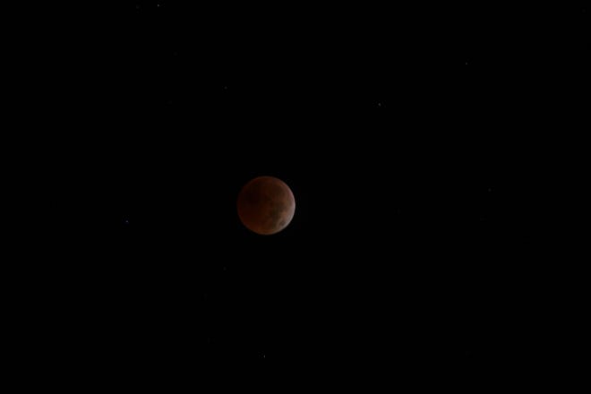 A total lunar eclipse could be seen early Tuesday morning when the moon orbited into the Earth's shadow.