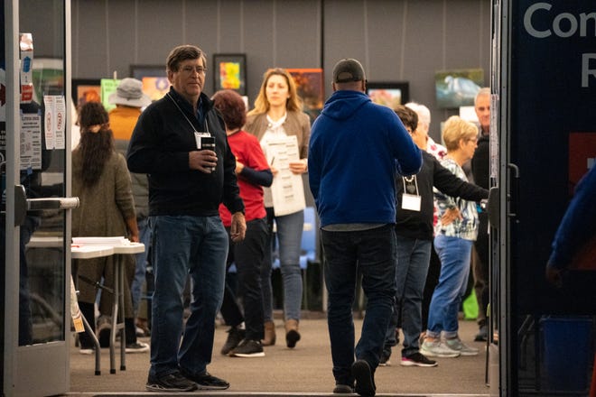Voters are greeted as they arrive on Nov. 8, 2022, at the Tempe History Museum.