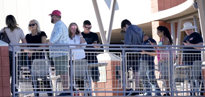 Voters wait 2 hours in line to cast their vote at Mesa Community College Red Mountain Campus on Nov. 8, 2022.