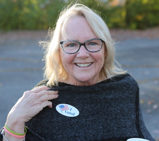 Cindy Erickson, of Wilmington, shows off her 'I Voted' sticker on Tuesday.