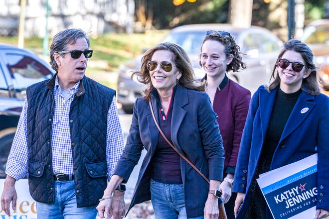 Attorney General Kathy Jennings, her husband Dave White, at left, and team members arrive to cast their votes in the midterm elections at Immanuel Church Highlands in Wilmington, Tuesday, Nov. 8, 2022.