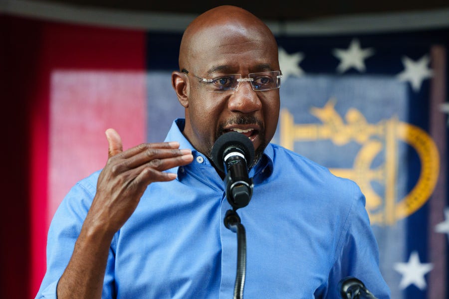 Sen. Raphael Warnock, D-Ga., campaigns in Macon on Nov. 7, 2022, the day before midterm elections.