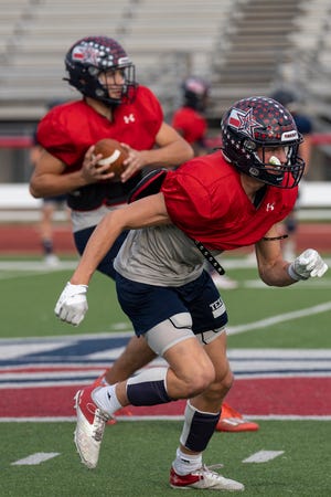 Lane Patek runs a route during Wimberley's practice on Tuesday. The Texans finished the regular season 10-0 and host San Antonio YMLA Thursday to open up the playoffs.