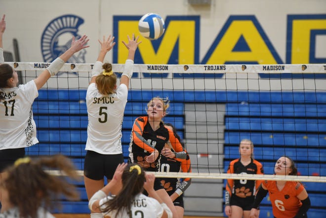 Hudson's Lauren Hill swings for a kill during Tuesday's Division 3 regional at Madison against Monroe St. Mary Catholic Central.