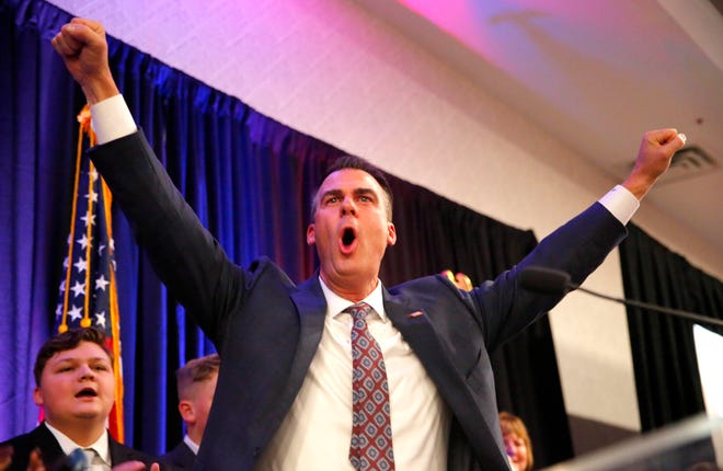 Gov. Kevin Stitt cheers before speaking during an GOP election night watch party in Oklahoma City, Tuesday, Nov. 8, 2022.