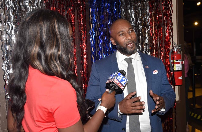 Third District Democrat candidate Shuwaski Young does a television interview at his election party at Soulshine Pizza in Flowood on Tuesday, Nov. 8.