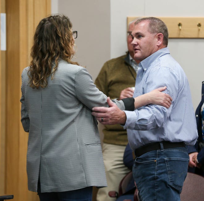 Jacque Chosnek, City Attorney for the City of Lafayette, stops Bob Goldsmith, incumbent candidate for Tippecanoe County Sheriff, to congratulate him on his lead during the election night updates, on Nov. 8, 2022, in Lafayette.