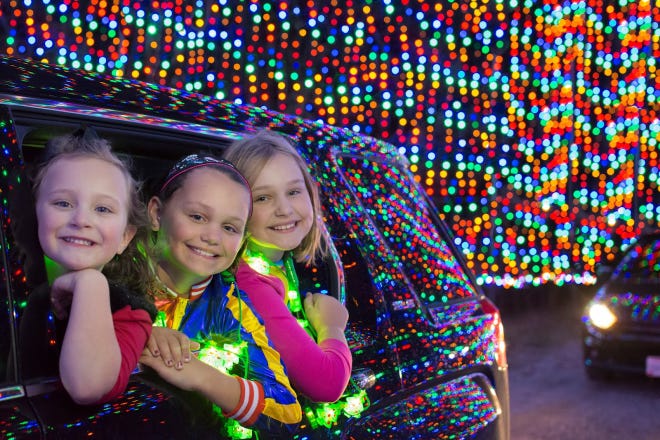 Tunnels of lights and lighted displays are part of a holiday-themed Magic of Lights exhibition at Collier County Fairgrounds.