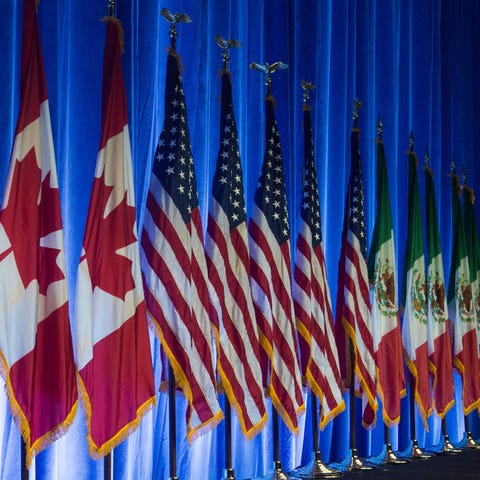 The flags of Canada, the United States, and Mexico