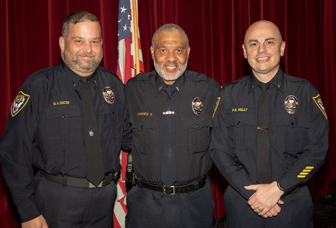 Alliance Police Department celebrated the promotions of, from left, Matthew Shatzer to lieutenant; Akenra X to captain; and Pat Kelly to lieutenant during an event Tuesday, Nov. 8, at Firehouse Theatre in Alliance.