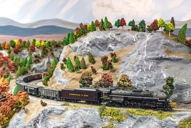 A model train representing a Chesapeake and Ohio engine passes through a section of the Appalachian Mountains at the Blissfield Model Railroad Club, 109 E. Adrian St. near downtown Blissfield.