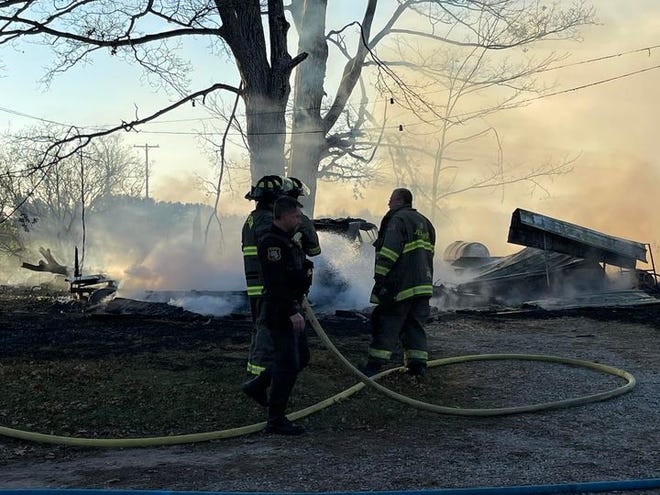 A Hillsdale County Sheriff's deputy worked with firefighters to ensure the residents of the home were safe while extinguishing the fire.