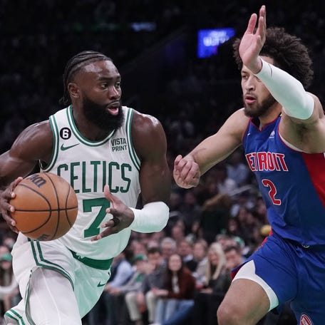 Celtics guard Jaylen Brown drives to the basket against Pistons guard Cade Cunningham during the first half Wednesday, Nov. 9, 2022, in Boston.