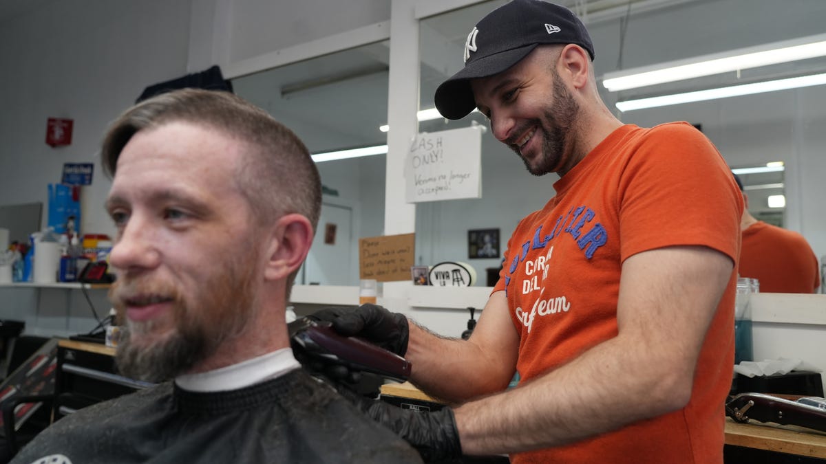 Nov 8, 2022; Northampton County, PA, USA;  Chris Corona cuts Brendan McCabe's hair Wednesday. Both voted in the midterm elections and consider themselves independent minded voters. In swing-state Pennsylvania, Trump won the election in 2016, but in 2020 Biden snatched a narrow victory. Northampton County is a bellwether for the state. Mandatory Credit: Megan Smith-USA TODAY ORG XMIT: USAT-515305 [Via MerlinFTP Drop]