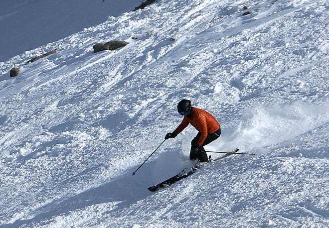 A skier makes his way down Kit Carson at Mt. Rose Ski Tahoe on opening day, Nov. 11, 2022.