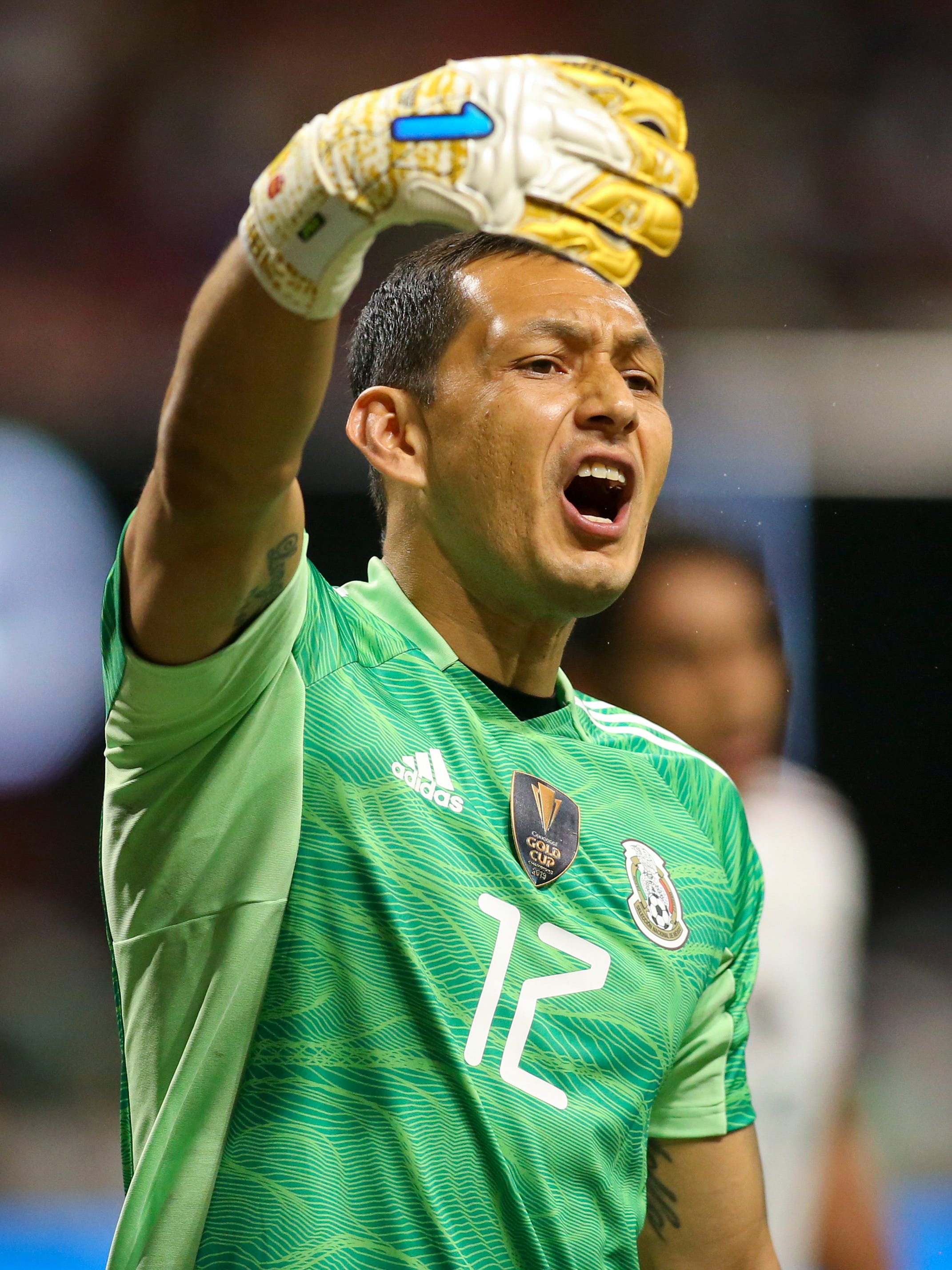 An action image of Rodolfo Cota playing soccer.