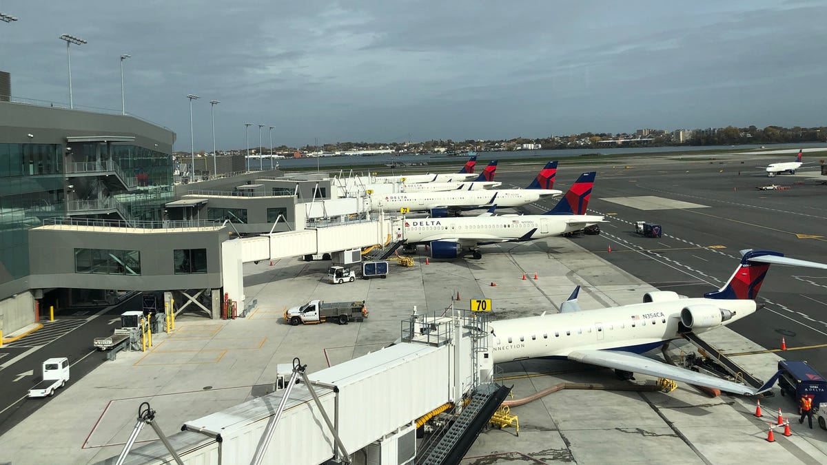 A row of Delta Air Lines planes, with a regional jet in the foreground similar to the one I was scheduled to fly on to Myrtle Beach.