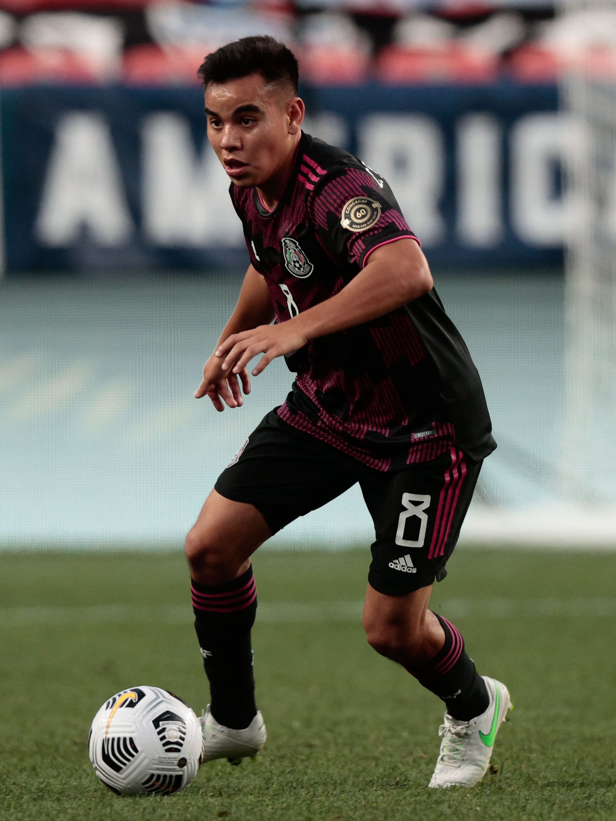 An action image of Carlos Rodriguez playing soccer.