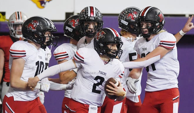 ADM quarterback Aiden Flora (2) celebrates with team mates after a touchdown against Harlan Community during the second quarter in the class 3A state football semi-final at the UNI Dome Saturday, Nov. 12, 2022, in Cedar Falls, Iowa.