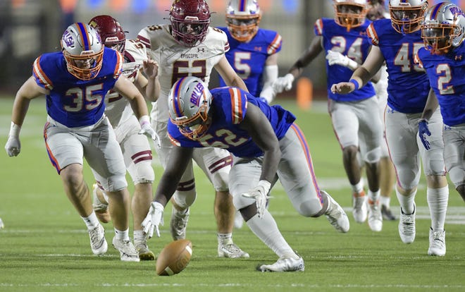 Bolles Bulldogs' Garrison Butler (52) scrambles to pick up a fumble by Episcopal Eagles's Nate Blair (11) during second quarter action. The Episcopal Eagles were hosted by The Bolles School Bulldogs at Skinner-Barco Stadium in the FHSAA Region 1-2M high school football quarterfinal game Friday, November 11, 2022.