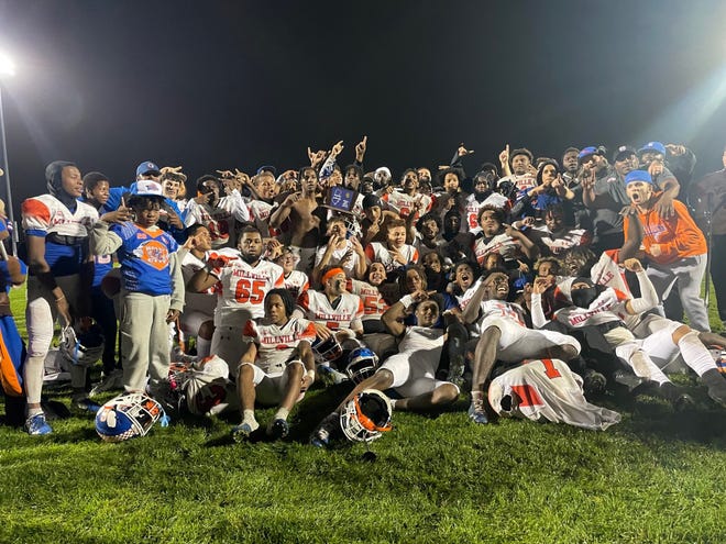 Millville celebrates after defeating Hammonton 18-16 in the South Jersey Group 4 final on Friday night.