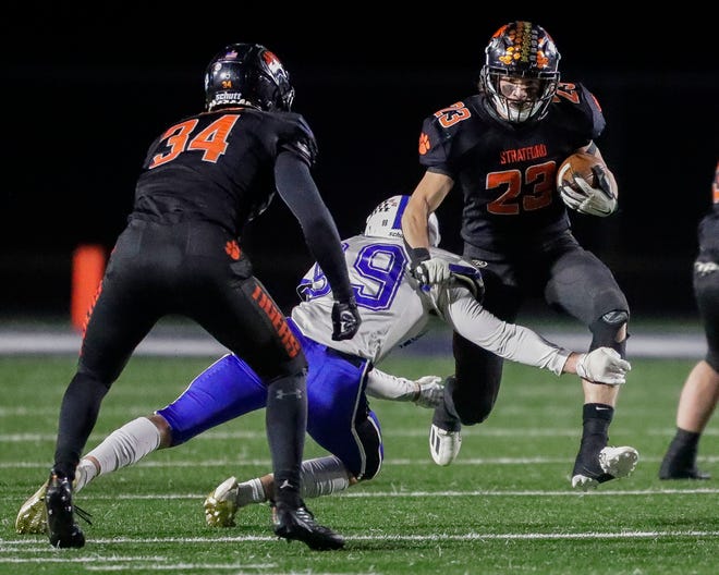 Stratford's Gavin Leonhardt (23) runs the ball against St. Mary's Springs during a WIAA Division 6 state semifinal Friday at Waupaca High School. The Tigers will face Mondovi in the state championship game Thursday in Madison.