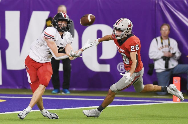 ADM running back Brevin Doll (15) catches the ball for a touchdown around Harlan Community safety Bryce Van Baale (24) during the fourth quarter in the class 3A state football semi-final at the UNI Dome Saturday, Nov. 12, 2022, in Cedar Falls, Iowa.