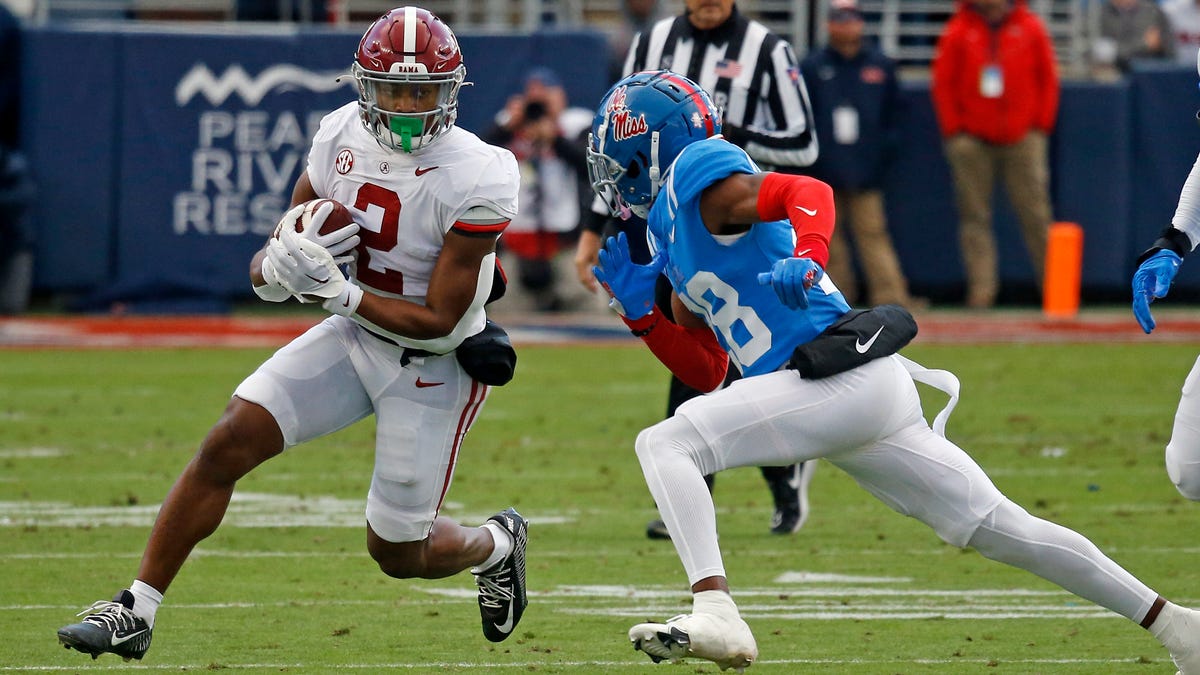 Alabama running back Jase McClellan (2) runs the ball as Mississippi defensive back Markevious Brown (28) attempts to make the tackle during the first half at Vaught-Hemingway Stadium.