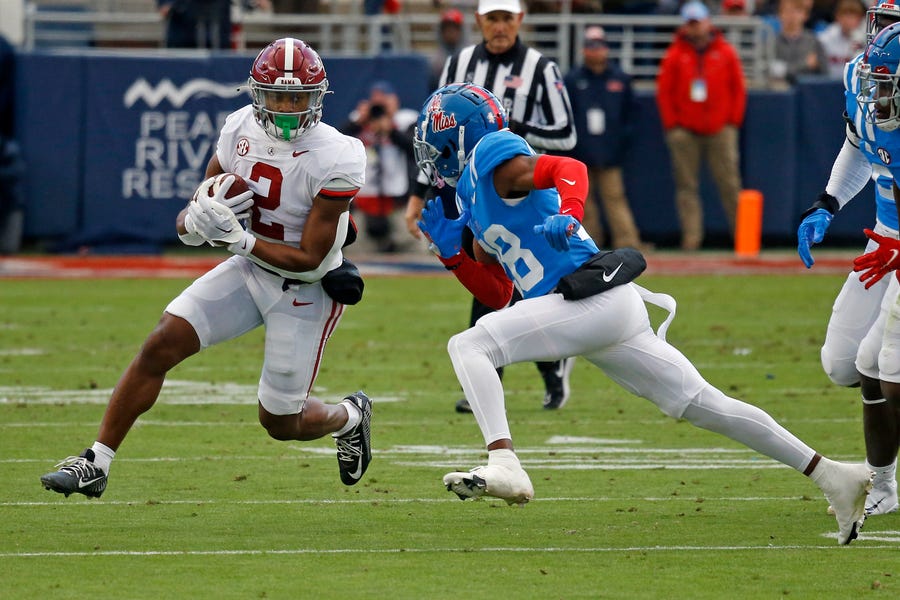 Alabama running back Jase McClellan (2) runs the ball as Mississippi defensive back Markevious Brown (28) attempts to make the tackle during the first half at Vaught-Hemingway Stadium.