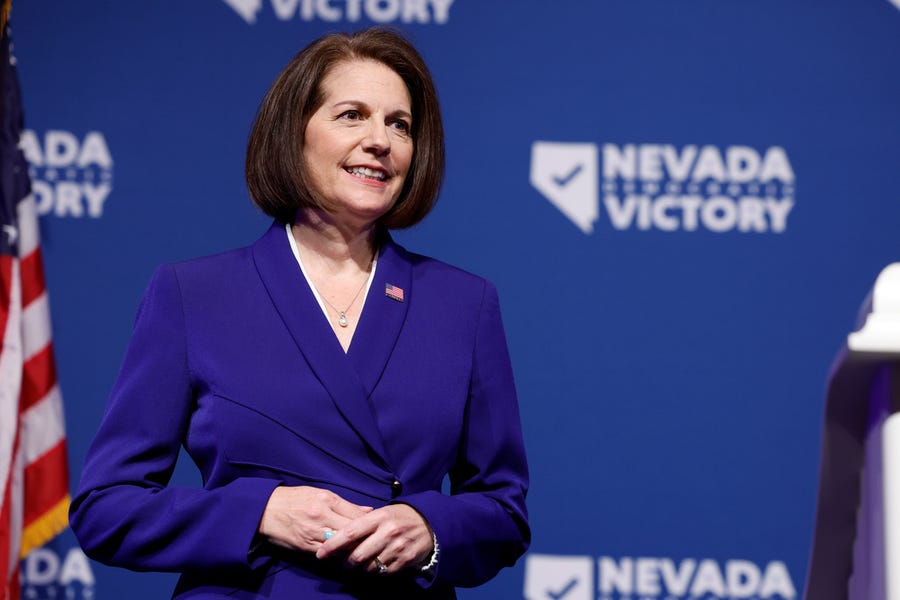 U.S. Sen. Catherine Cortez Masto, D-Nev. listens as Nevada Gov. Steve Sisolak speaks at an election night party hosted by Nevada Democratic Victory at The Encore on November 08, 2022 in Las Vegas, Nevada.
