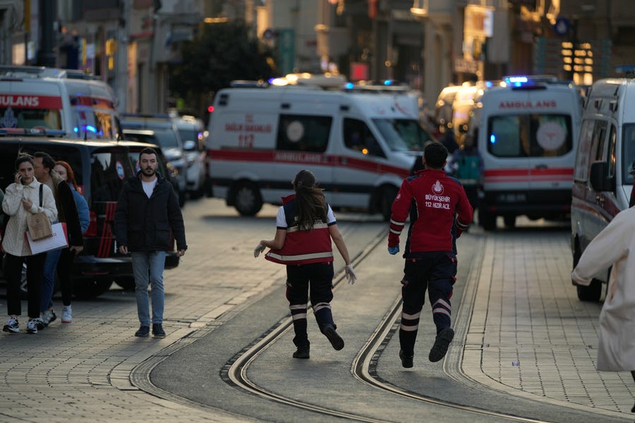 Security and ambulances at the scene after an explosion on  Istanbul's popular pedestrian Istiklal Avenue, Sunday, Nov. 13, 2022. Istanbul Gov. Ali Yerlikaya tweeted that the explosion occurred at about 4:20 p.m. and that there were deaths and injuries, but he did not say how many. The cause of the explosion was not clear.