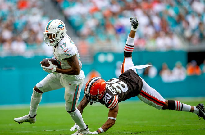 Miami Dolphins wide receiver Jaylen Waddle (17), runs by Cleveland Browns cornerback Greg Newsome II (20), for a first down doing fourth quarter action of their NFL action Sunday November 13, 2022 at Hard Rock Stadium in Miami Gardens.