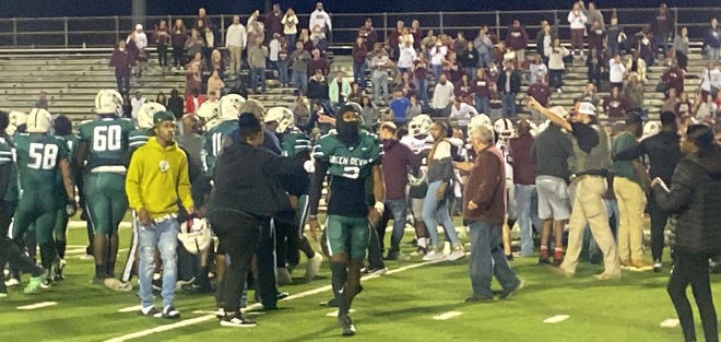 Authorities work to clear the field after a post-game brawl that ensued after Plaquemine’s playoff game against Jennings at Andrew Canova Field on Friday, Nov. 11.