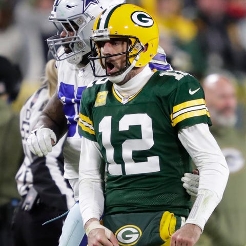 Green Bay Packers quarterback Aaron Rodgers (12) r