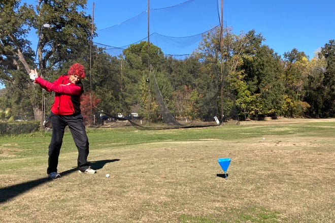 Kit Harvey of the Lake Redding Golf Course women's club tees off at the first hole on Monday, Nov. 14, 2022.