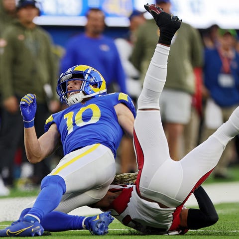 Cooper Kupp reacts after being hit by Marco Wilson