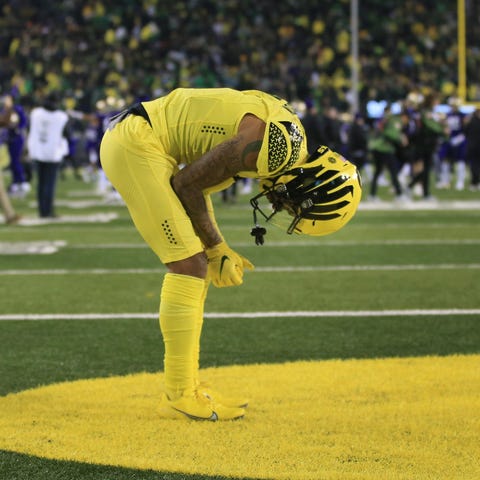 Oregon's Kris Hutson remains in the end zone after