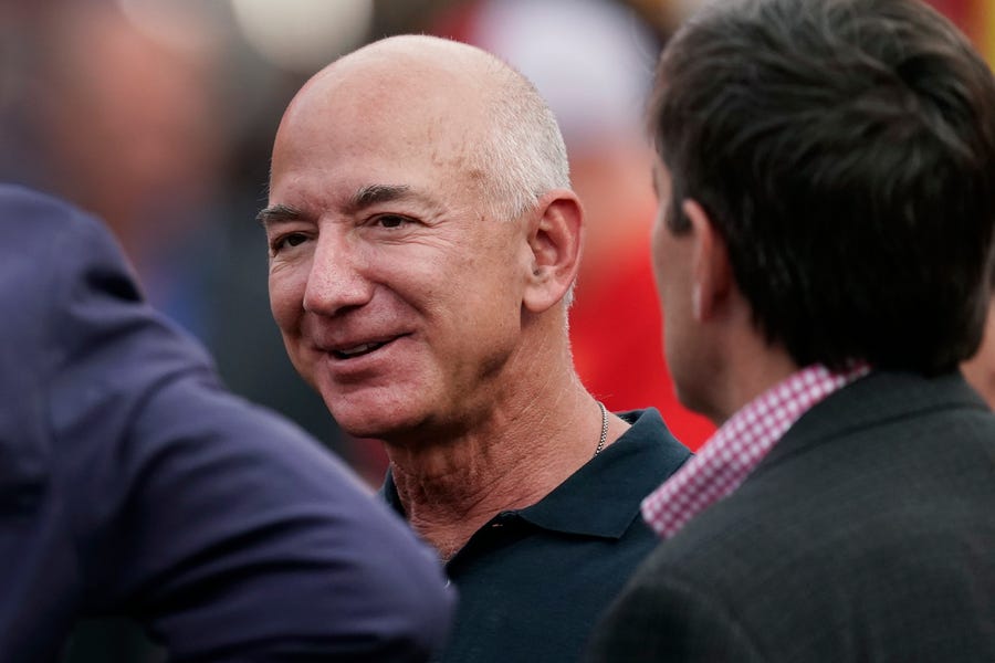 Amazon founder Jeff Bezos is seen on the sidelines before the start of an NFL football game on Sept. 15, 2022, in Kansas City, Mo.