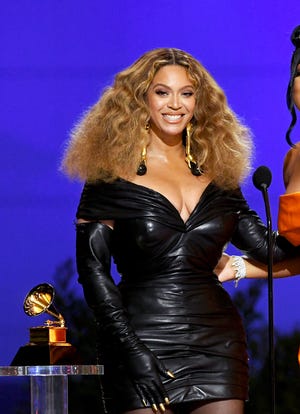 Beyoncé accepts the best rap performance Grammy for "Savage" during the 2021 ceremony. The "Church Girl" singer leads the 2023 nominations with nine nods.