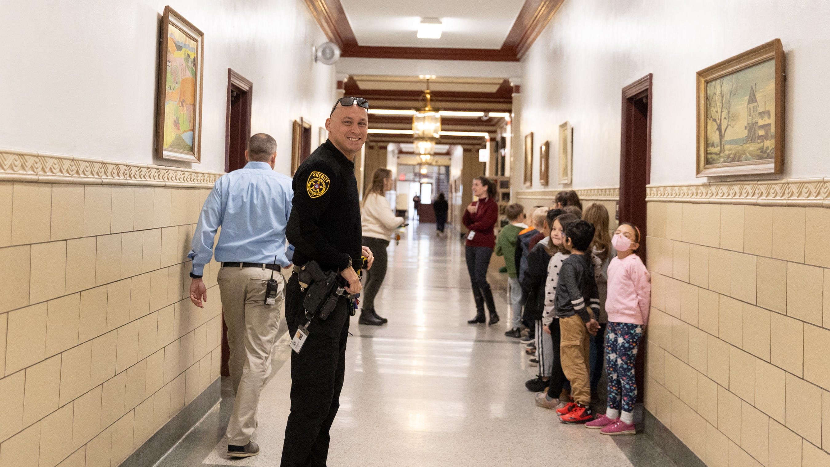 Officer Jason Beebe walks the halls in Livingston Manor School in Livingston Manor, NY, on Nov. 14, 2022.
