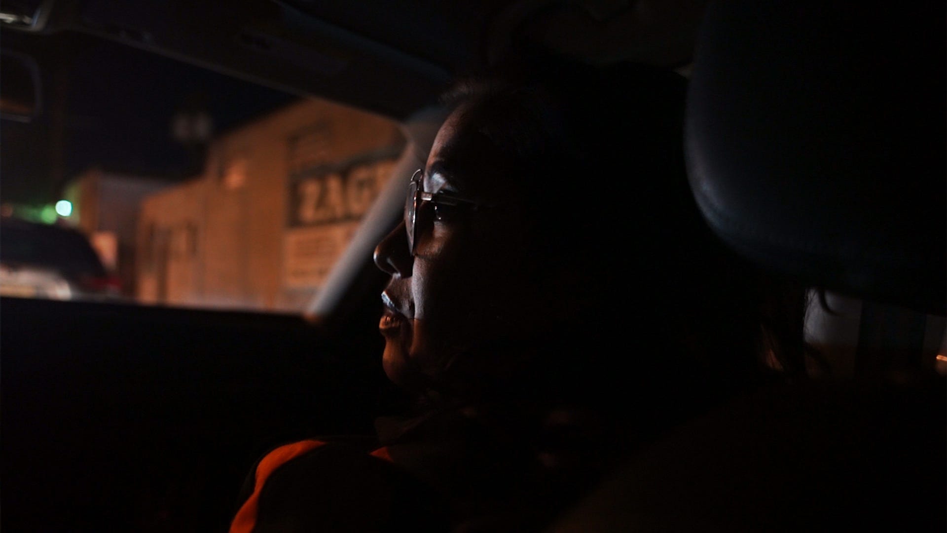 Liza Chowdhury, Project Director for the Paterson Healing Collective, arrives with a colleague to St. Joseph's University Medical Center following a double shooting in Paterson in the early morning hours of Oct. 15, 2022, in this image from the documentary, "Targeting Retaliation," by Michael Karas.