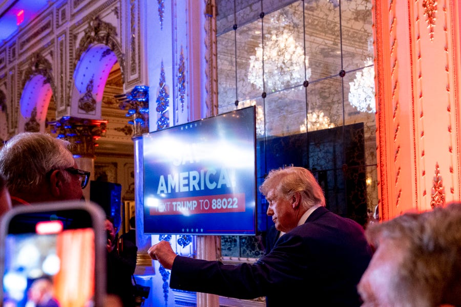 Former President Donald Trump greets guests at Mar-a-lago on Election Day, Tuesday, Nov. 8, 2022, in Palm Beach, Fla. (AP Photo/Andrew Harnik) ORG XMIT: FLAH139
