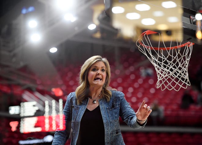 Photographed with the double exposure setting, Texas Tech's head coach Krista Gerlich gestures on the sideline against Jackson State in a preseason WNIT game, Tuesday, Nov. 15, 2022, at United Supermarkets Arena.