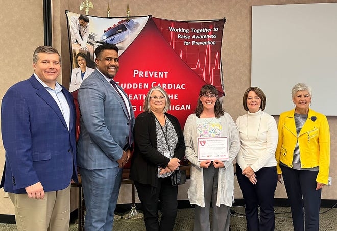 Nottawa school has been named a MI HEARTSafe school. Pictured third from right, Amy Falkenstein holds the district’s certificate.