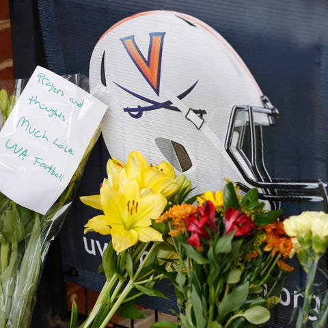 Mourners placed flowers outside Scott Stadium in m