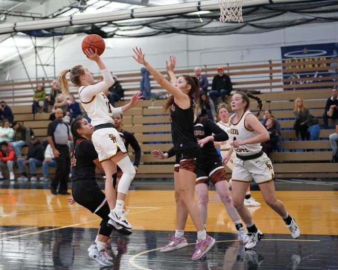 Siena Heights' Allye Minor pulls up for a shot during Wednesday's game against Lourdes.