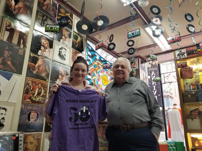 Weird Harold's Records owner Andrea Fritz (left) and store founder Danny Bessine pose in the store Tuesday.