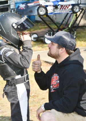 Alan Stipp (right) gives his son, Canon a pep talk before the final race of the year at Bohmer's Rt. 66 Raceway. A picture of consistency, the 8-year-old claimed the 2022 track championship in the Rookie class.