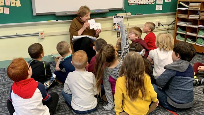 Lexington Elementary teacher Mary Beth DelCalzo reviews the sounds that various letters make as part of a literacy lesson with her kindergarten students. Marlington Local is one of only 25 school districts in Ohio to receive a $200,000 state grant that is aimed at helping schools improve how they teach literacy.