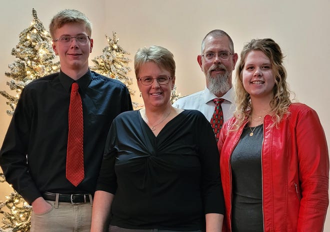 Wendy Miller, lead pre-K teacher at Good Neighbor Place in Newcomerstown, with her husband, Paul, standing in back row; son, Rolston, left; and daughter Brittyn.